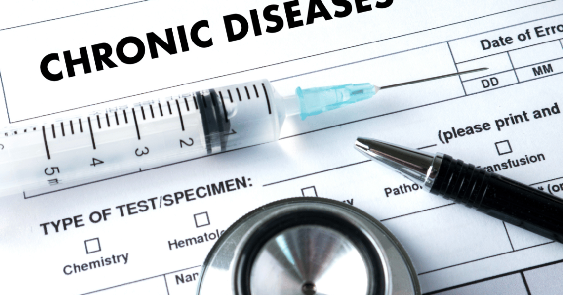 Picture of chronic disease form, syringe, pen and stethoscope