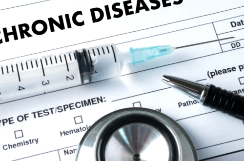 Picture of chronic disease form, syringe, pen and stethoscope